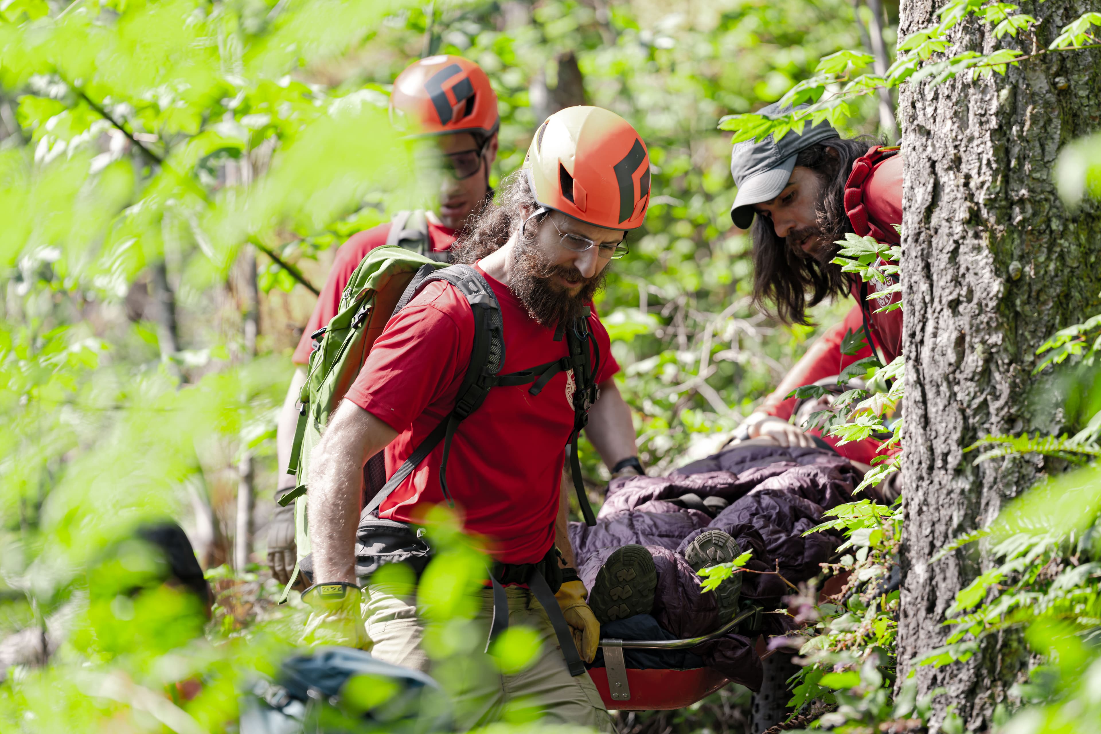 Rescuers using a litter to evacuate a subject