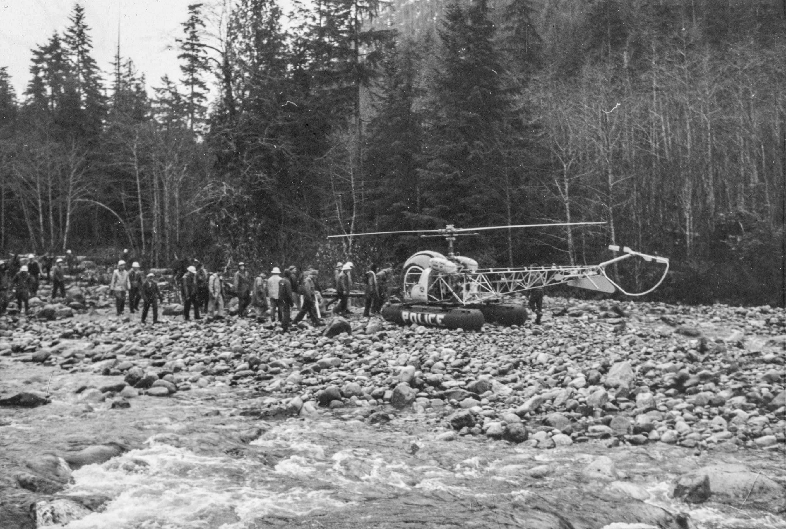 Rescuers walking towards a helicopter